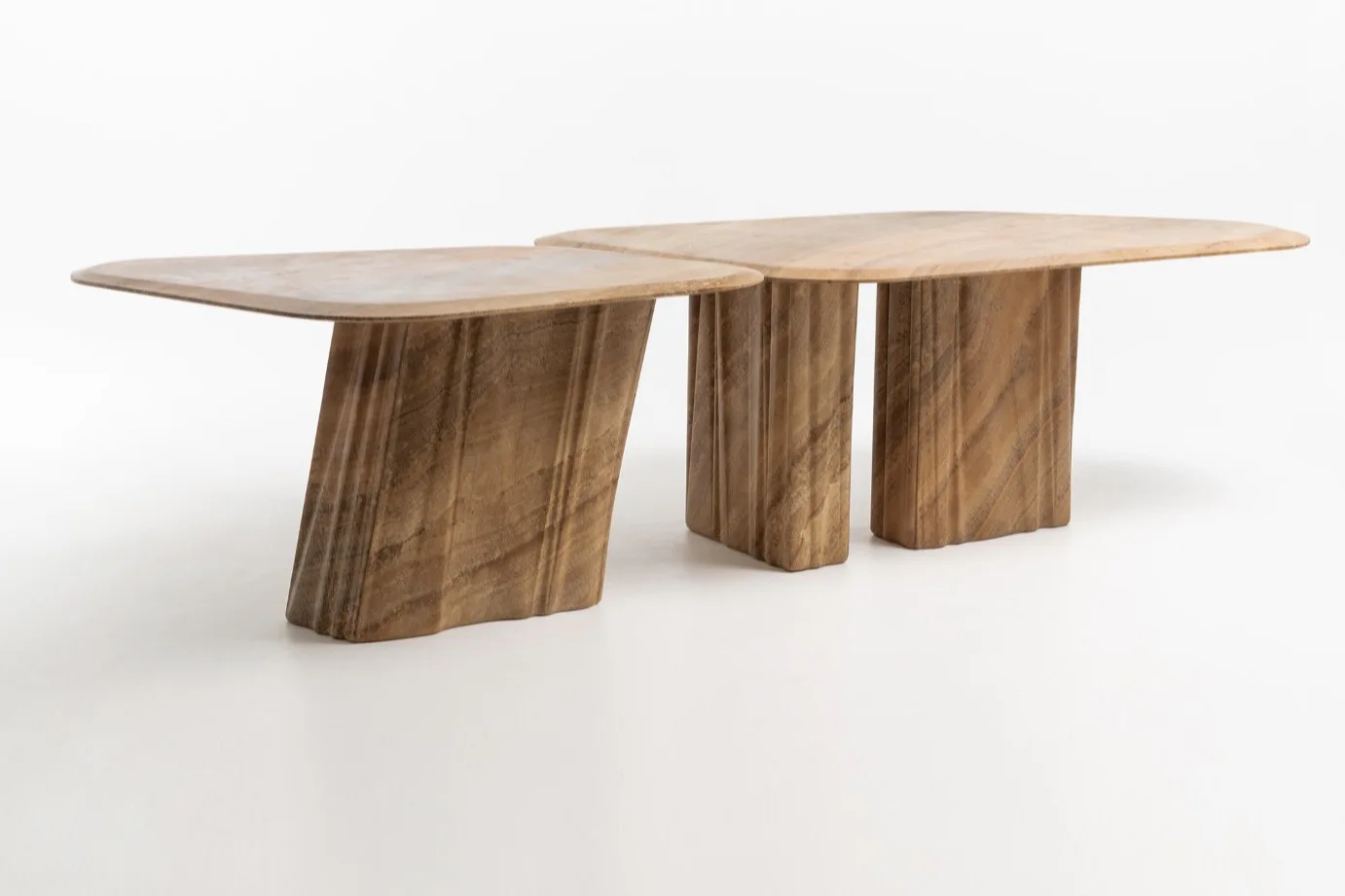 Wave stone tables with curved tops and sculptural supports